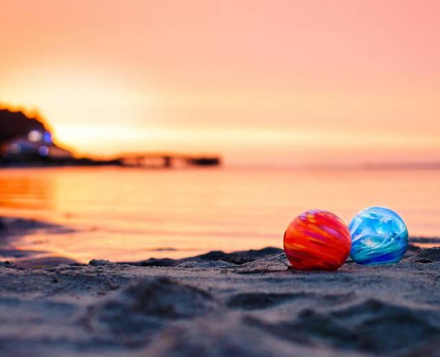 Photo of two glass floats on the beach in Lincoln City